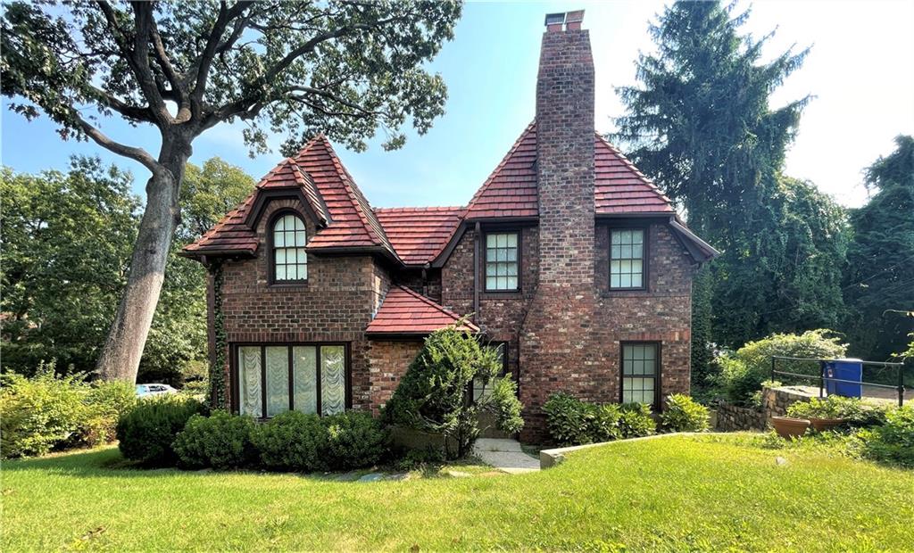 24 Wendover Road Queens, NY 11375 - Photo 32 of 34 a front view of a house with a yard