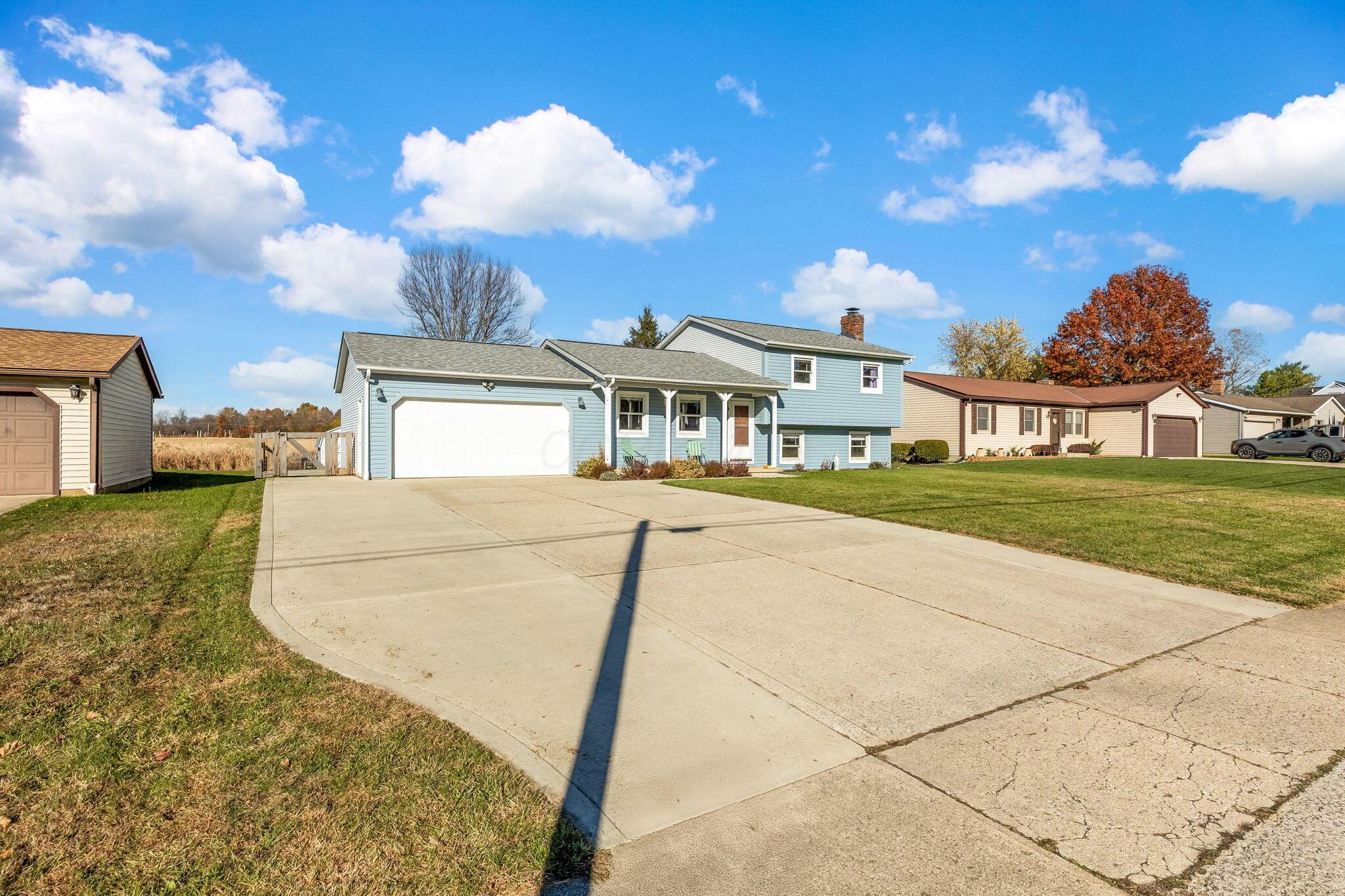 728 Cheshire Road Sunbury, OH 43074 - Photo 2 of 54 Front with large concrete driveway