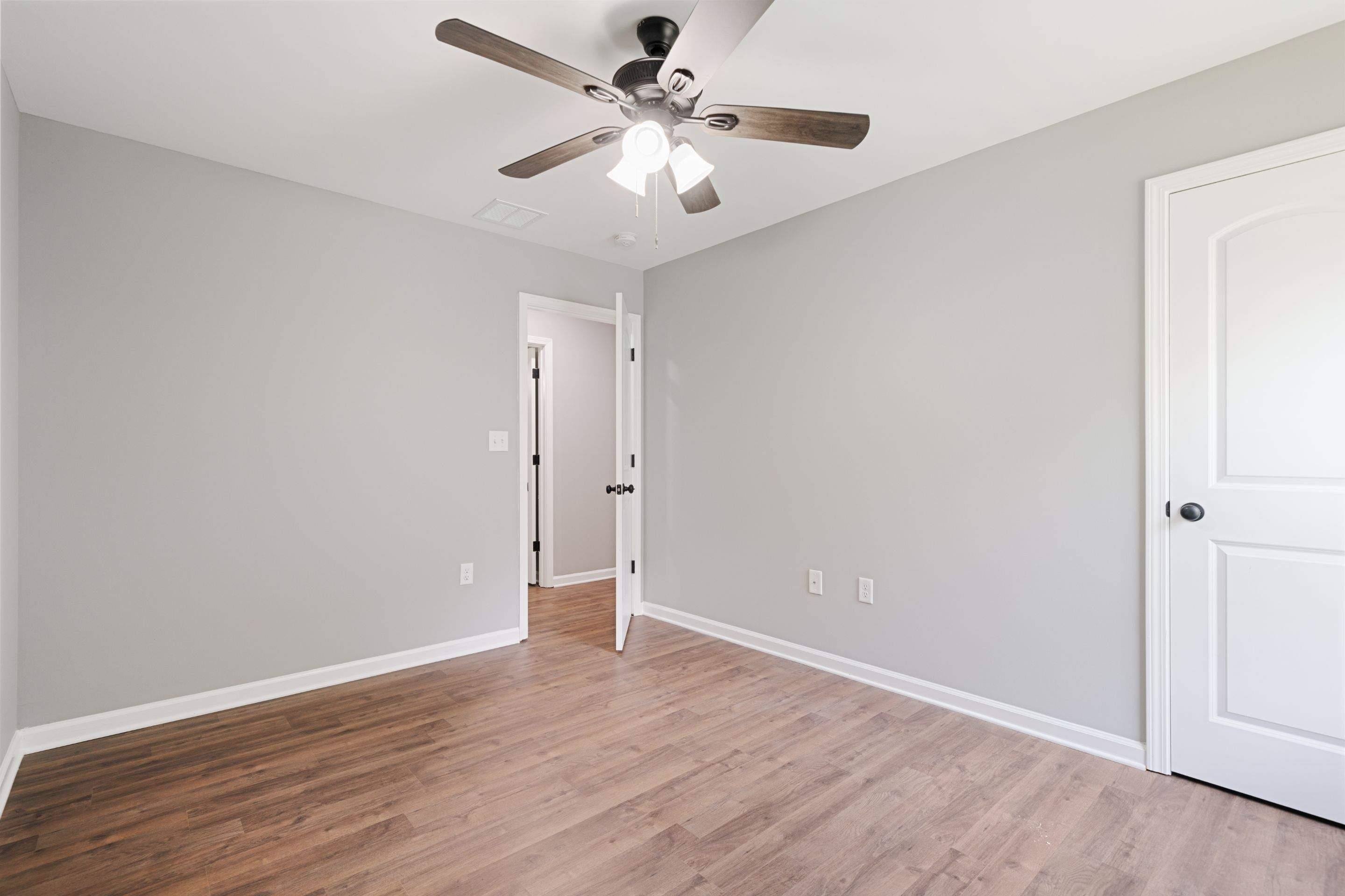 3766 Grey Road Memphis, TN 38108 - Photo 4 of 12 a view of an empty room with wooden floor