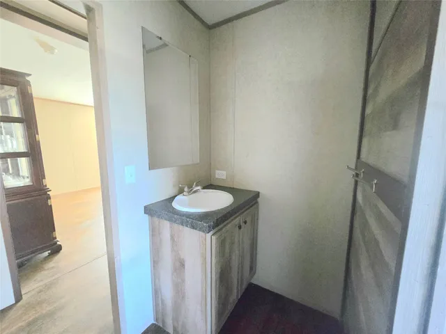 a bathroom with a sink and mirror