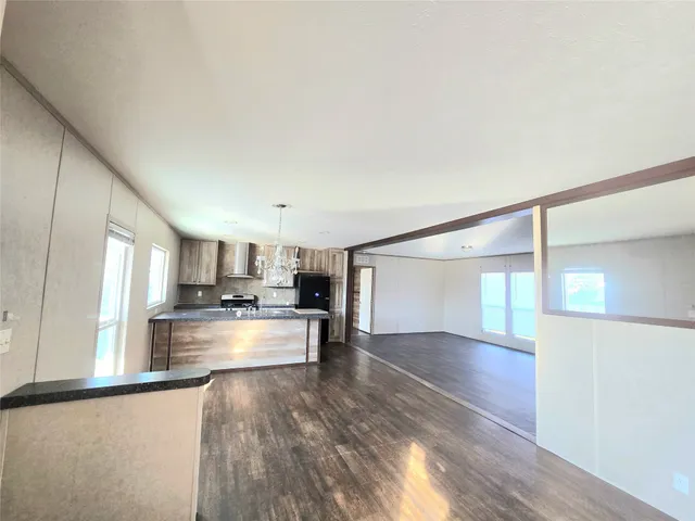 a kitchen with counter top space cabinets and appliances