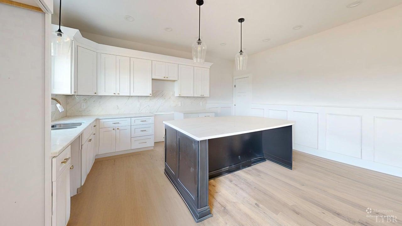 766 Moorman Mill Road Rustburg, VA 24588 - Photo 11 of 42 a kitchen with a stove sink and cabinets