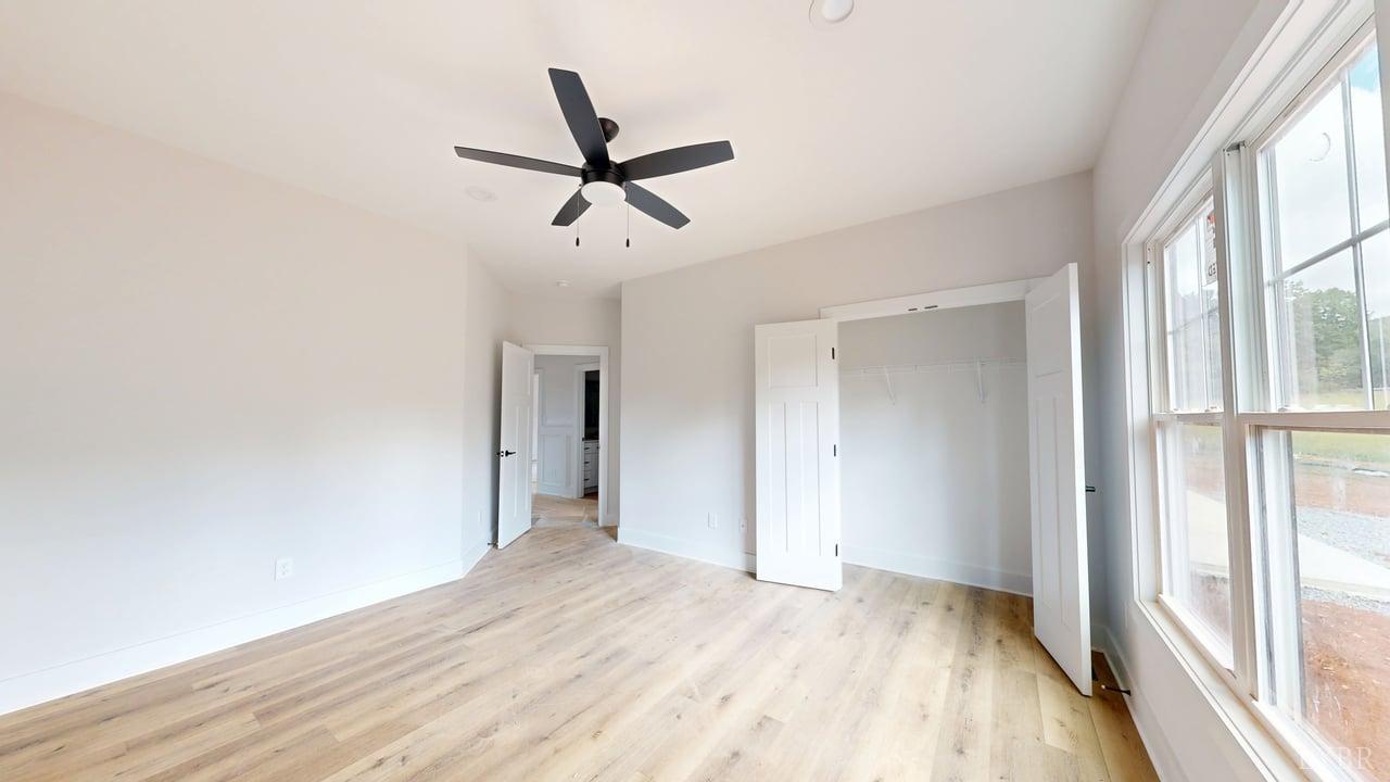 766 Moorman Mill Road Rustburg, VA 24588 - Photo 14 of 42 a view of empty room with wooden floor and fan