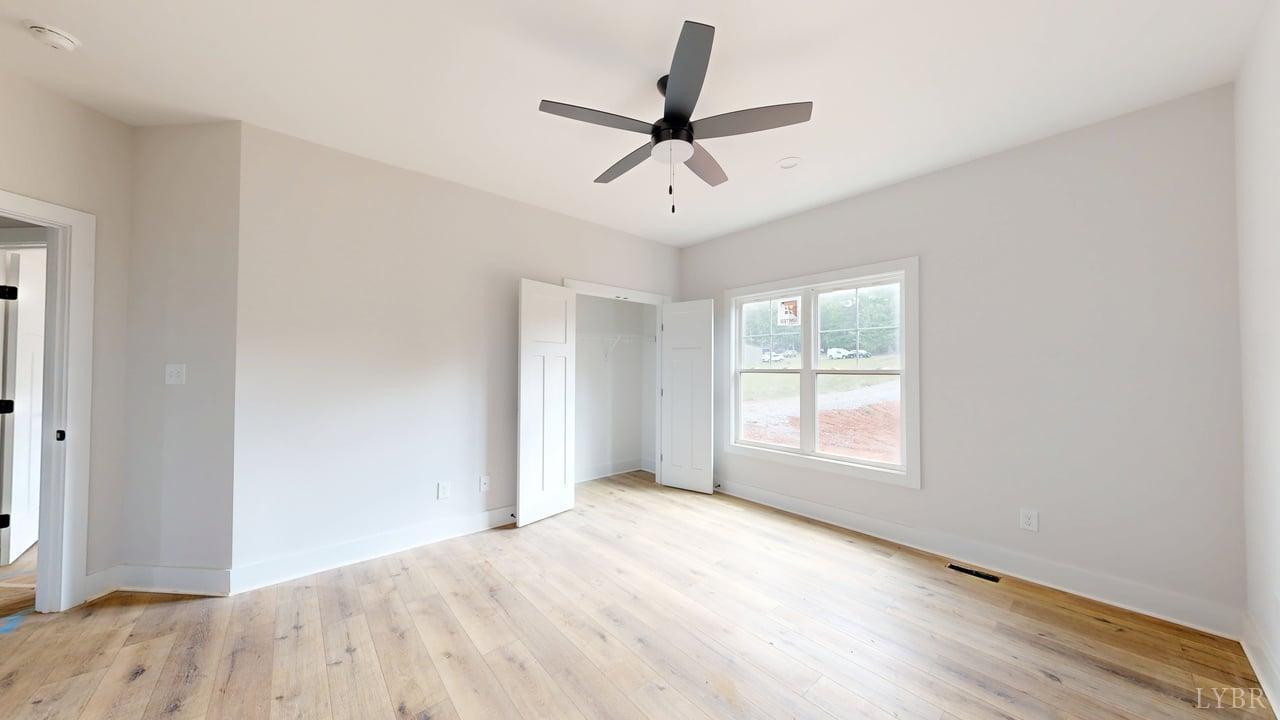 766 Moorman Mill Road Rustburg, VA 24588 - Photo 16 of 42 wooden floor in an empty room with a window