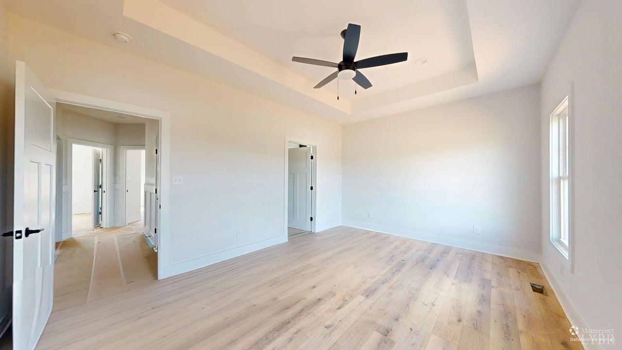 766 Moorman Mill Road Rustburg, VA 24588 - Photo 17 of 42 a view of empty room with wooden floor and ceiling fan