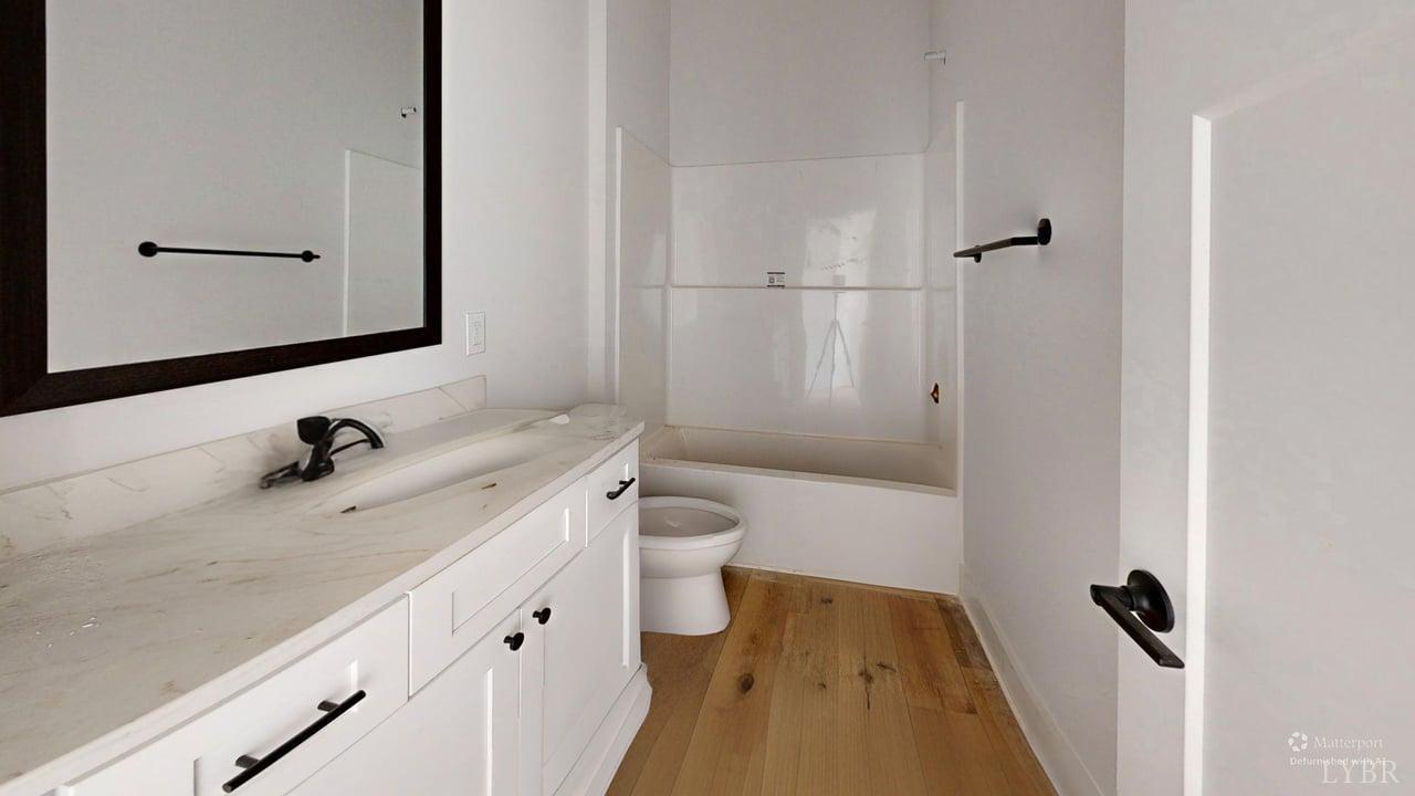 766 Moorman Mill Road Rustburg, VA 24588 - Photo 23 of 42 a bathroom with a tub sink and mirror