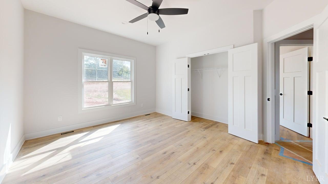766 Moorman Mill Road Rustburg, VA 24588 - Photo 26 of 42 a view of an empty room with window and wooden floor
