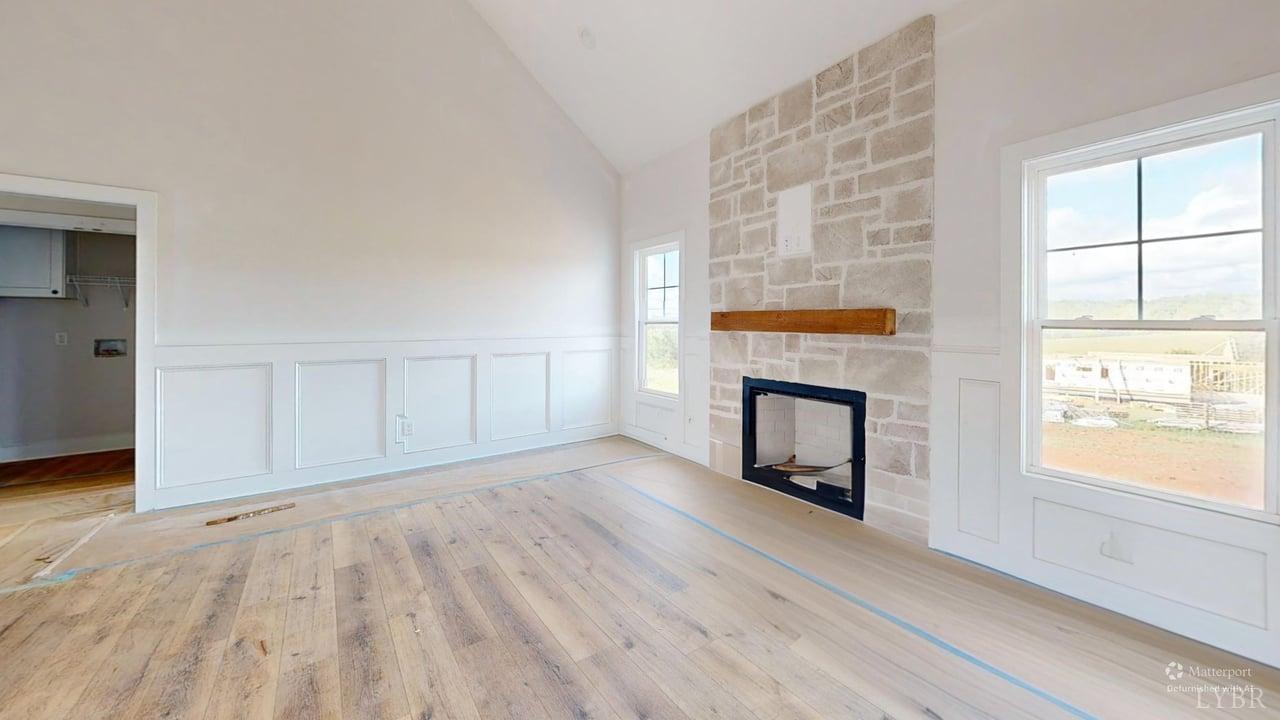 766 Moorman Mill Road Rustburg, VA 24588 - Photo 4 of 42 wooden floor fireplace and windows in an empty room