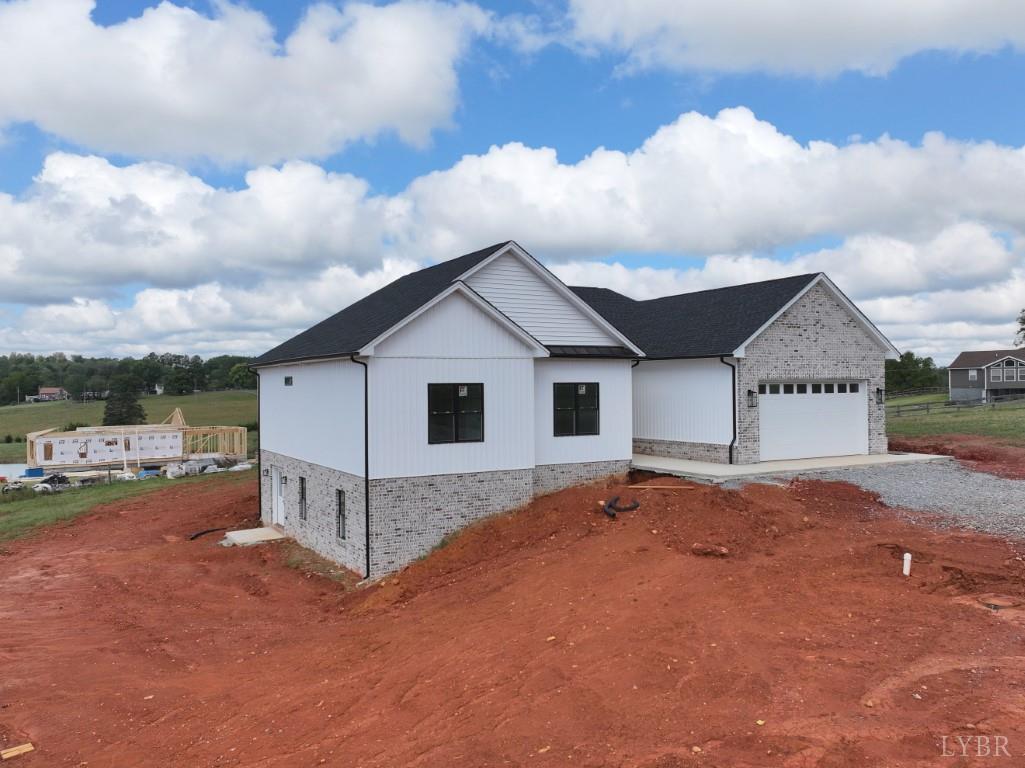 766 Moorman Mill Road Rustburg, VA 24588 - Photo 41 of 42 a view of a house with a yard