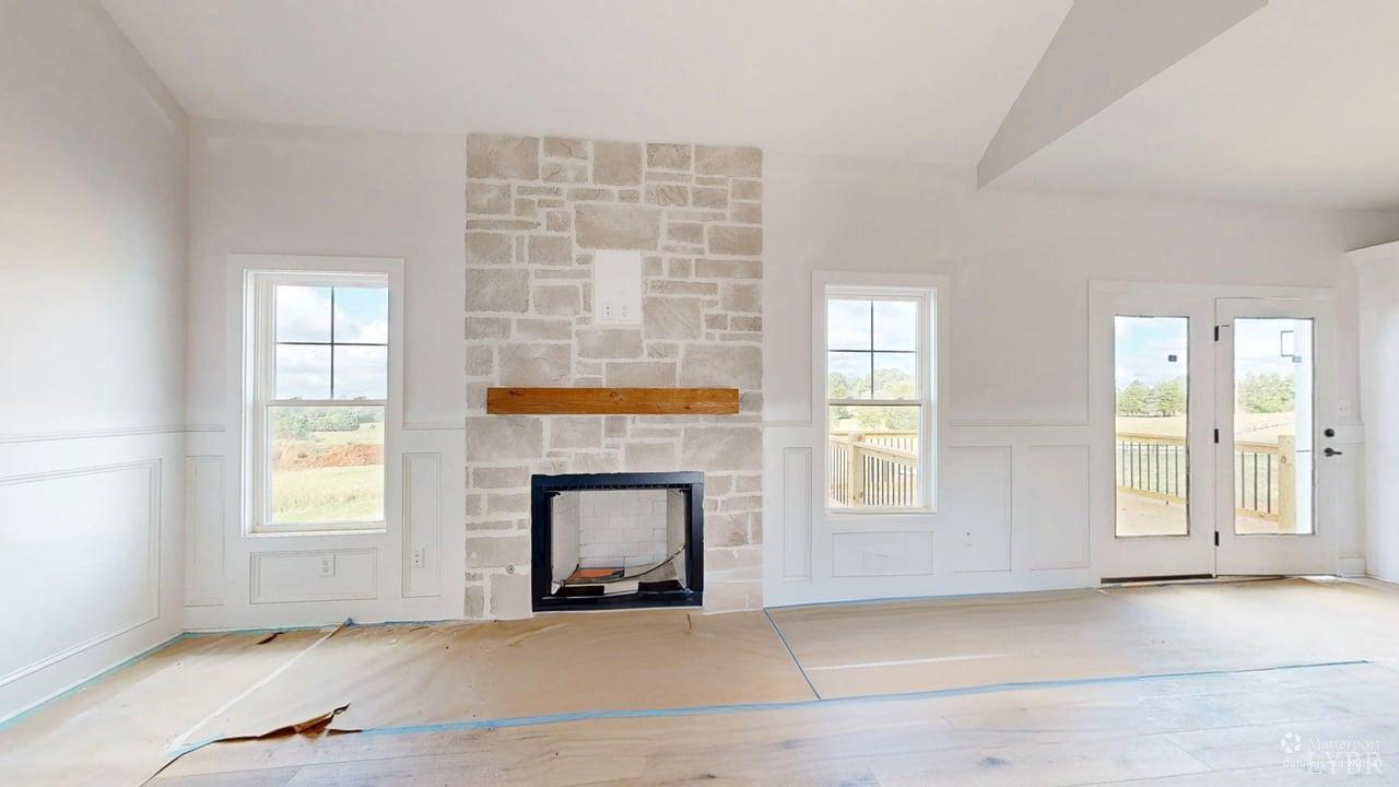 766 Moorman Mill Road Rustburg, VA 24588 - Photo 5 of 42 an empty room with windows and fireplace