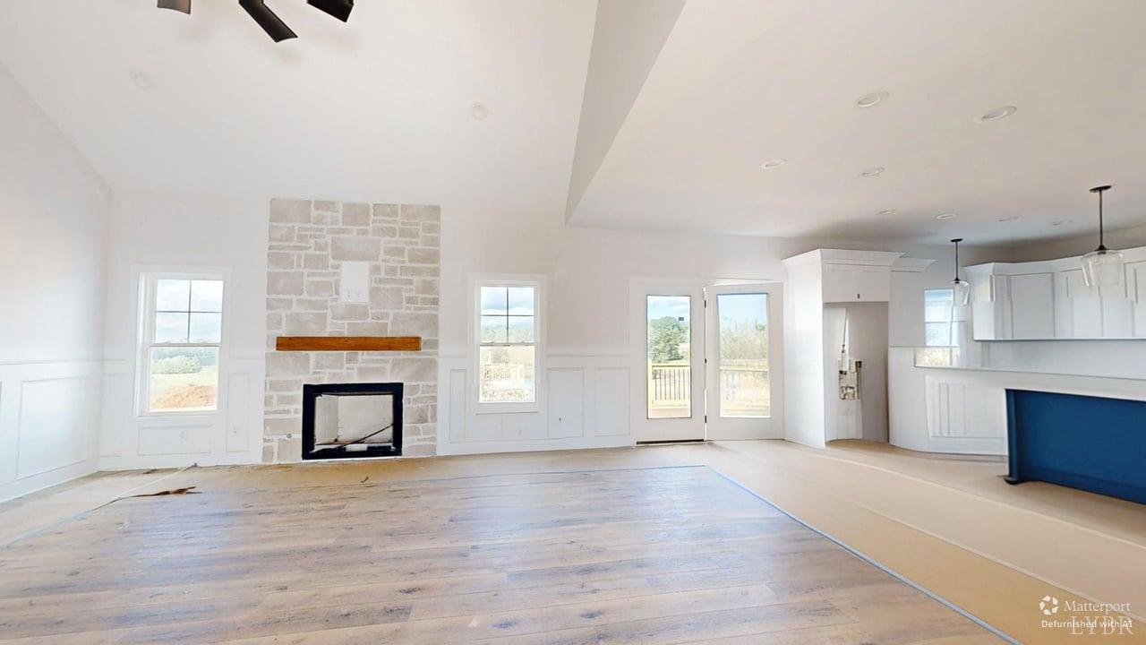 766 Moorman Mill Road Rustburg, VA 24588 - Photo 6 of 42 an empty room with windows and a fireplace
