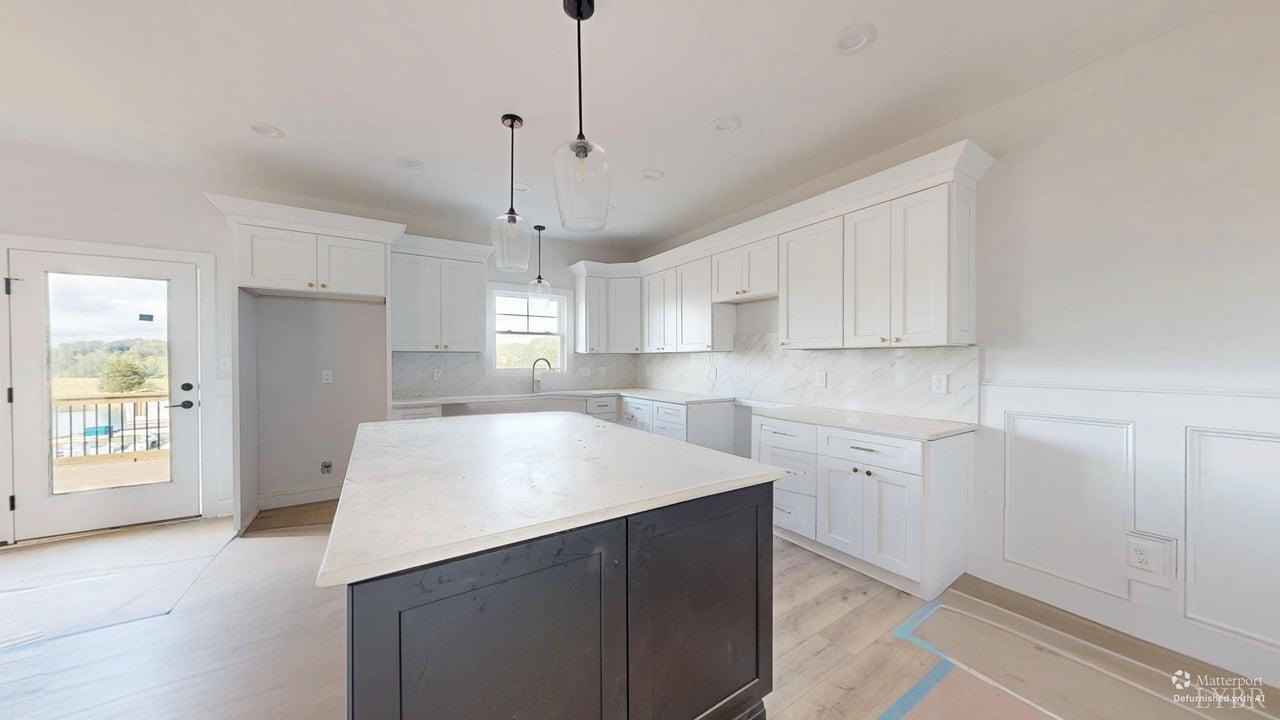 766 Moorman Mill Road Rustburg, VA 24588 - Photo 8 of 42 a kitchen with kitchen island white cabinets and window
