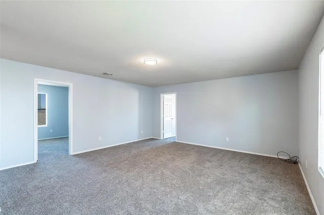 a view of an empty room and window