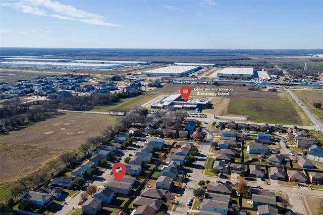 an aerial view of residential building and ocean