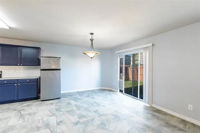 a view of a kitchen with a sink and cabinet