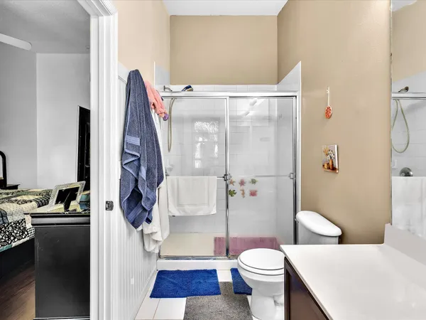 a bathroom with a sink toilet and shower