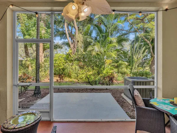 a view of a balcony with chair and table