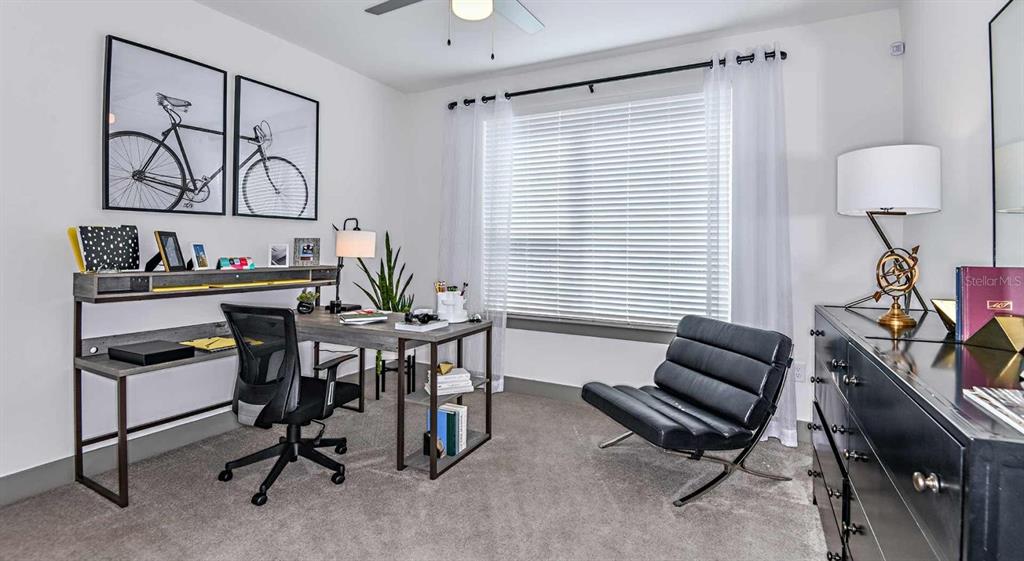1040 Jamison Loop, Unit REVIVE Kissimmee, FL 34744 - Photo 14 of 18 a view of a livingroom with furniture and a window