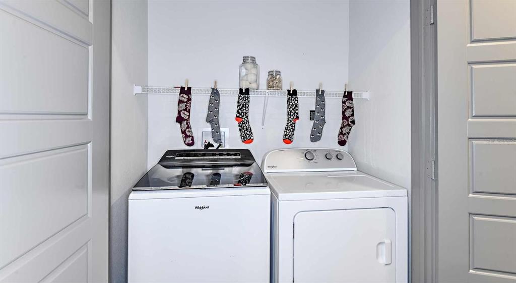 1040 Jamison Loop, Unit REVIVE Kissimmee, FL 34744 - Photo 17 of 18 a view of washer and dryer