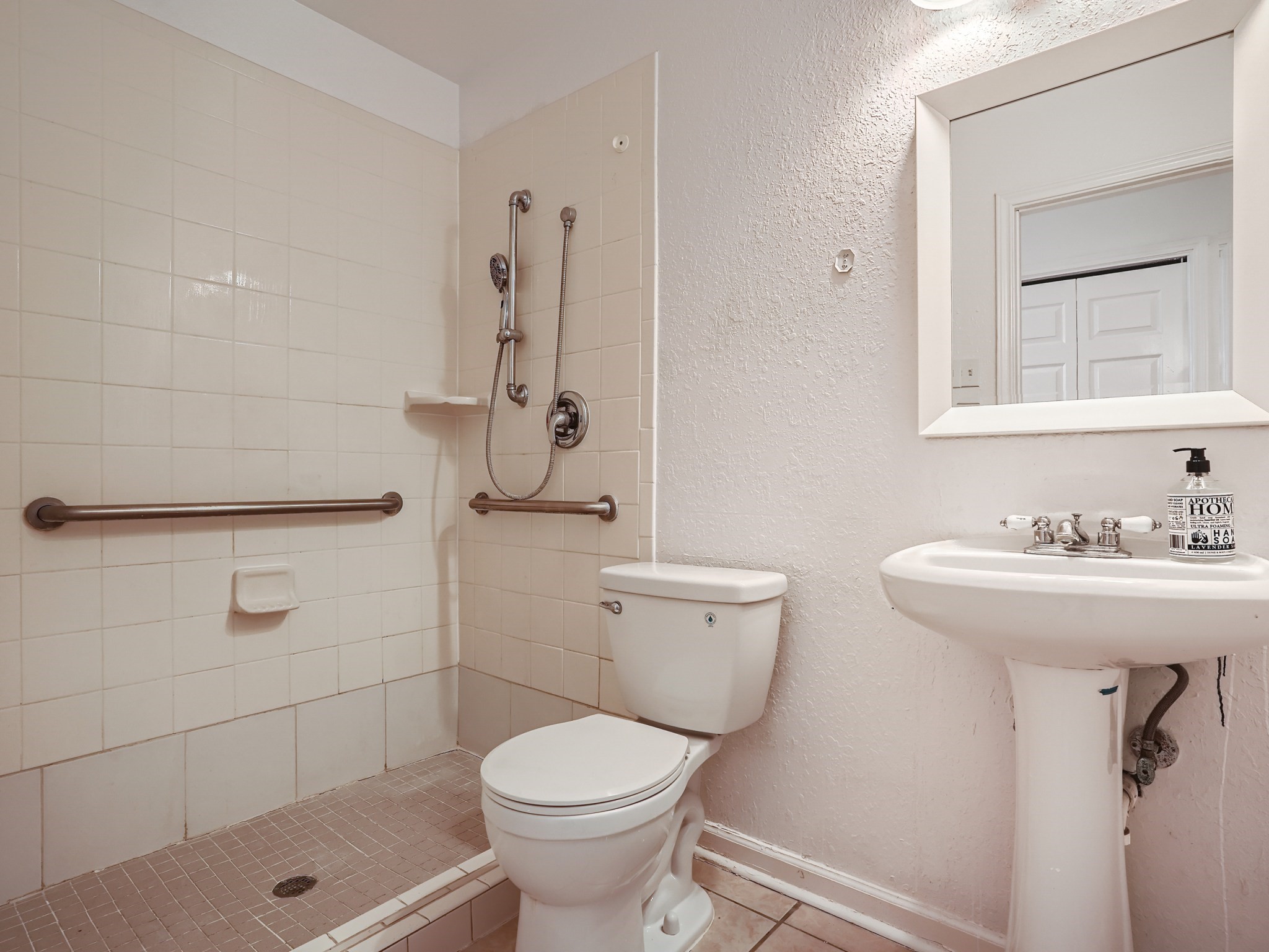 811 Canyon Bend Road Pflugerville, TX 78660 - Photo 10 of 11 a bathroom with a sink a toilet and shower
