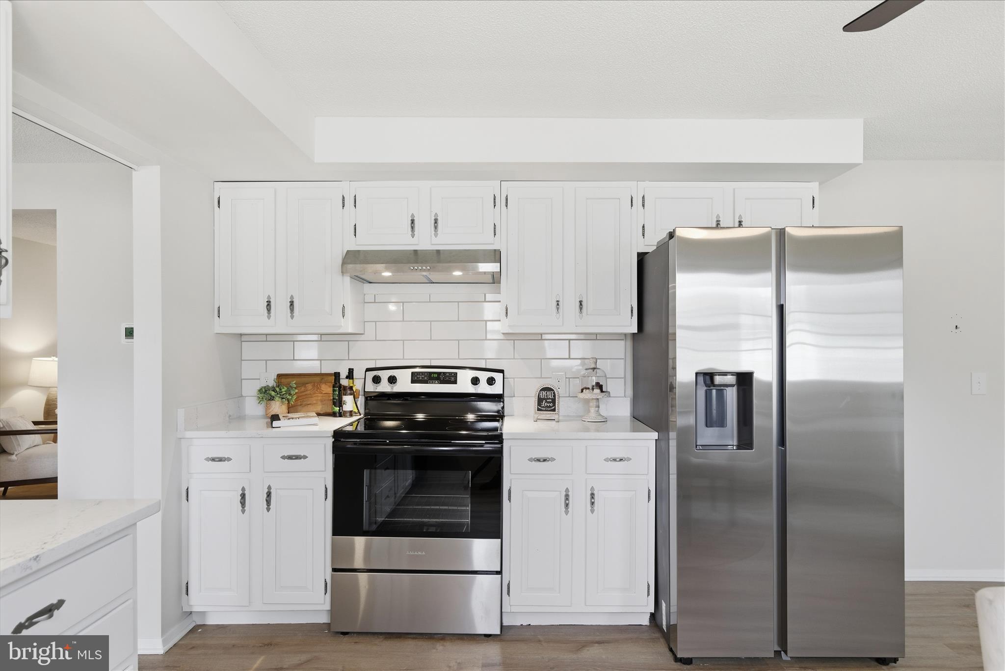 2430 Opal Road York, PA 17408 - Photo 24 of 59 a kitchen with stainless steel appliances and white cabinets