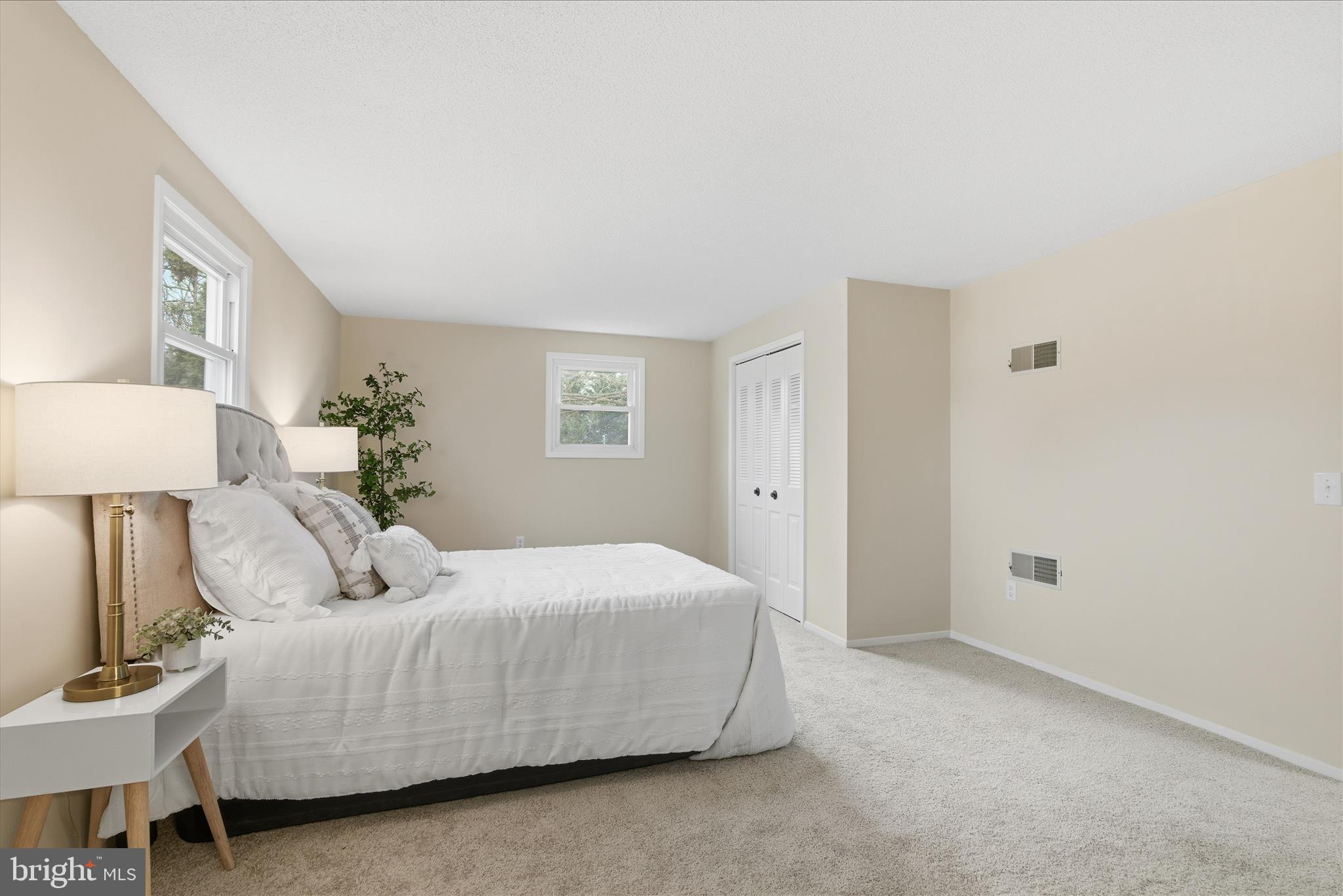 2430 Opal Road York, PA 17408 - Photo 33 of 59 a bedroom with a bed and a lamp