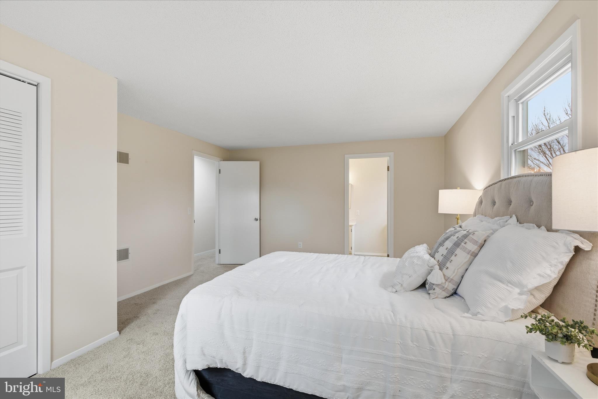 2430 Opal Road York, PA 17408 - Photo 34 of 59 a bedroom with a bed and a night stand