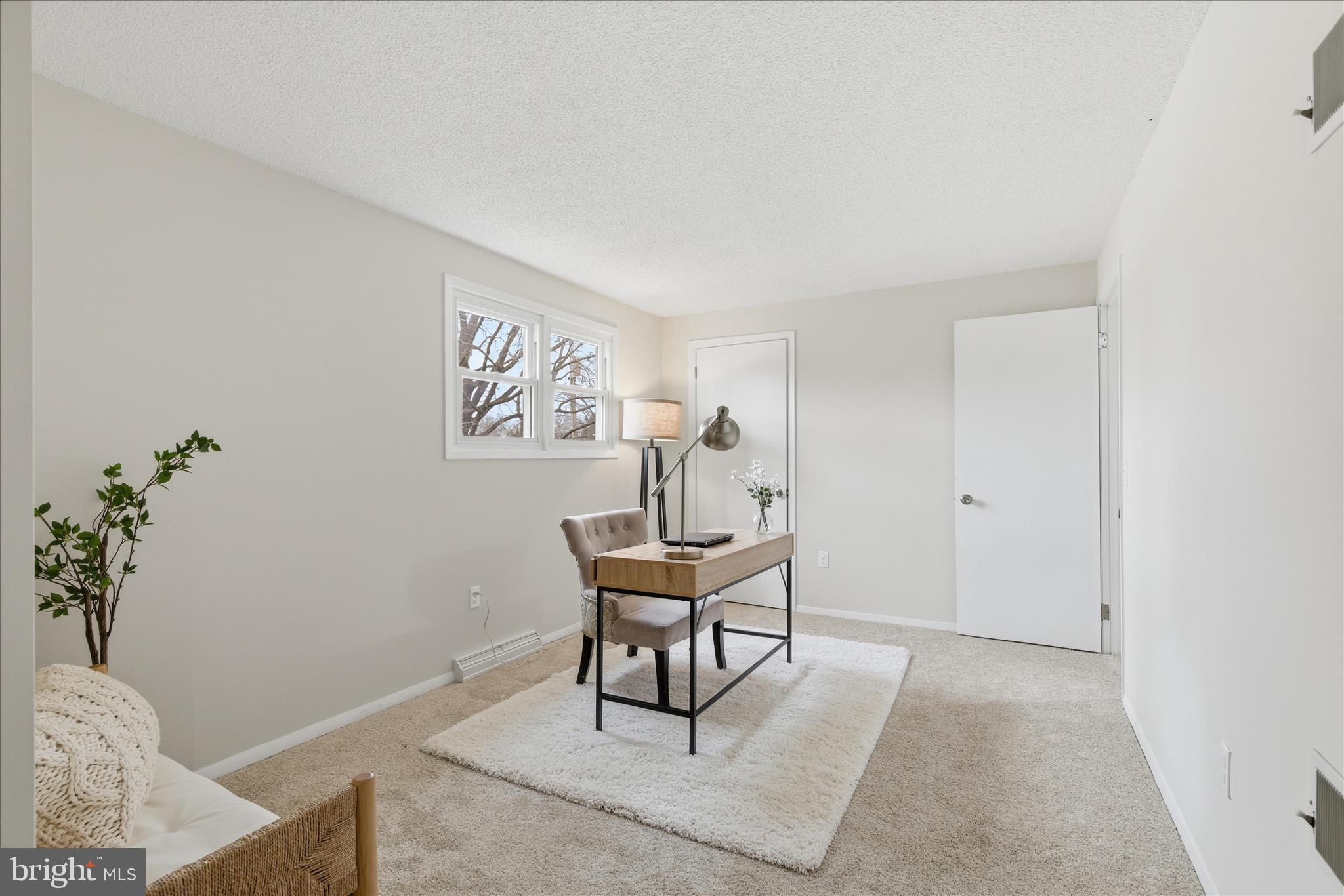 2430 Opal Road York, PA 17408 - Photo 41 of 59 a workspace room with painting on the wall and a potted plant