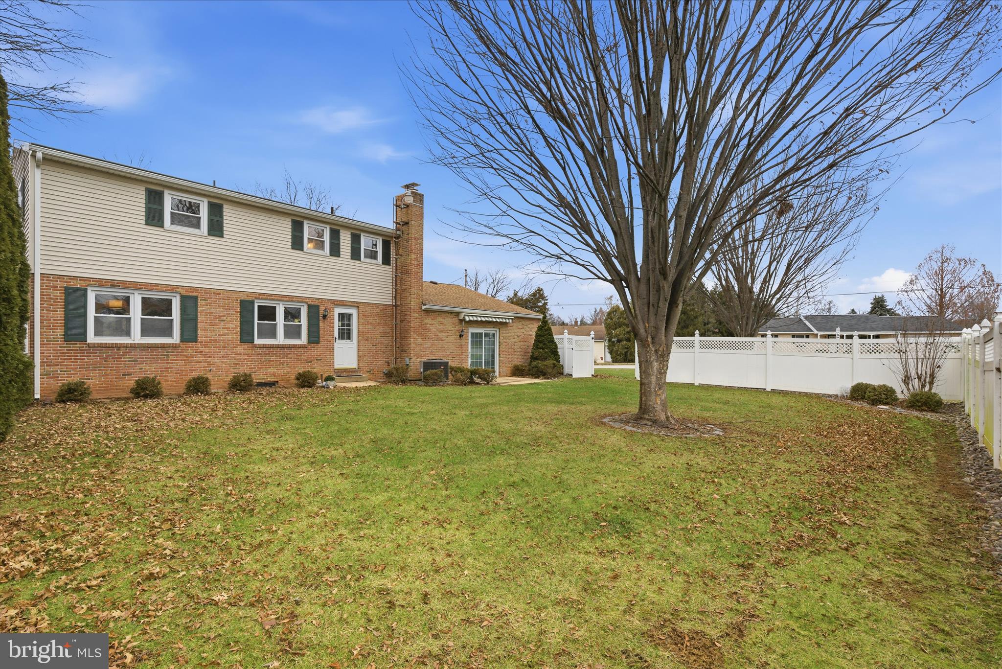 2430 Opal Road York, PA 17408 - Photo 54 of 59 a view of a yard in front of a house with a large tree