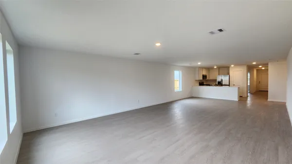 a view of a livingroom and a kitchen