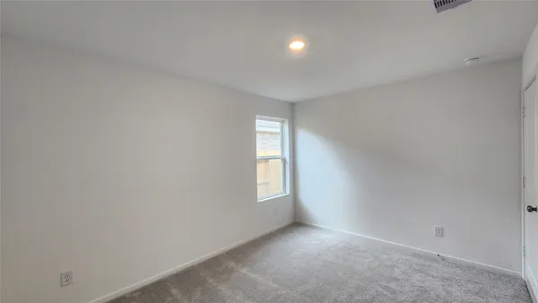 a bathroom with a bathtub and a toilet