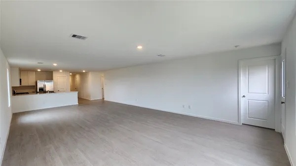 a view of a livingroom and a hallway