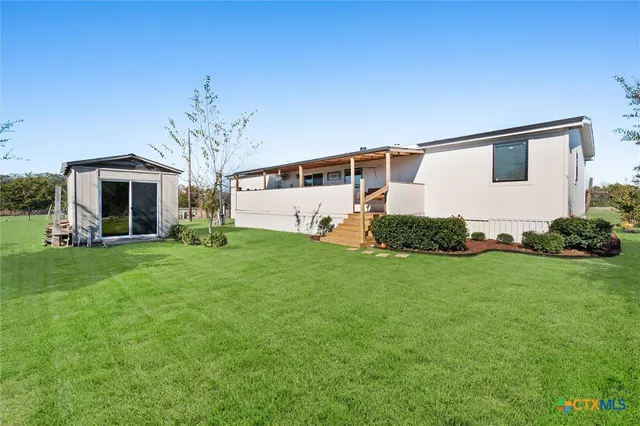 a view of a porch with furniture