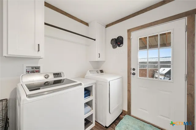 a bathroom with a sink vanity mirror and toilet