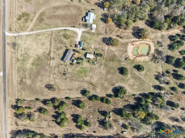 a view of a swimming pool with a yard