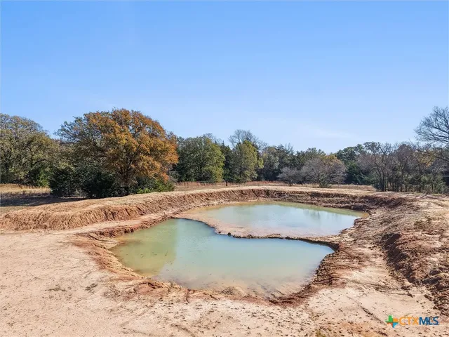 a living room with furniture and next to a window