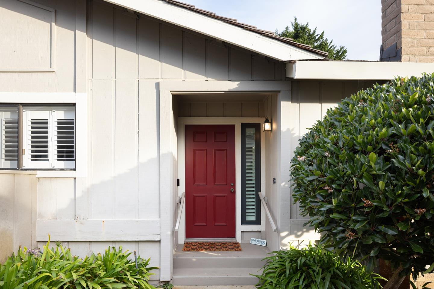 3850 Rio Road, Unit 63 Carmel, CA 93923 - Photo 2 of 19 a front view of a house with a garage