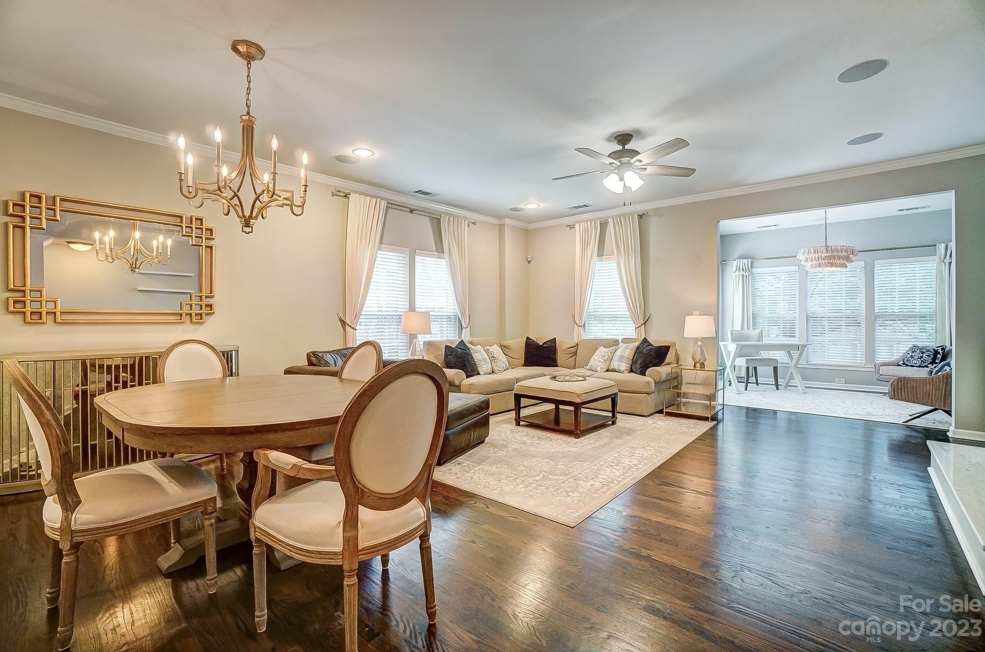 231 Lincoln Street Charlotte, NC 28203 - Photo 12 of 48 a living room with furniture a chandelier and a chandelier