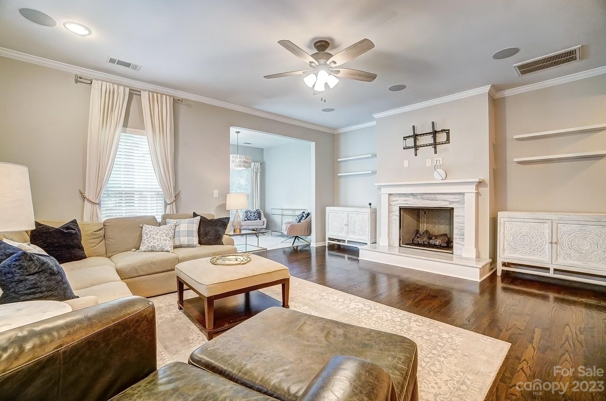 231 Lincoln Street Charlotte, NC 28203 - Photo 14 of 48 a living room with furniture and a fireplace