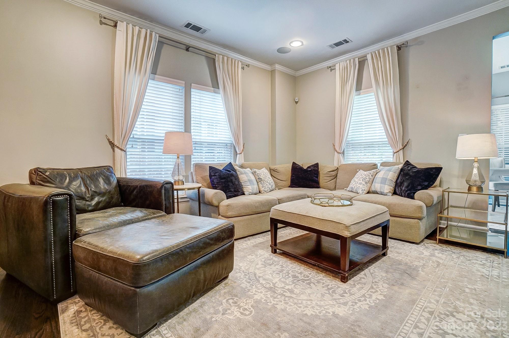 231 Lincoln Street Charlotte, NC 28203 - Photo 17 of 48 a living room with furniture and a large window