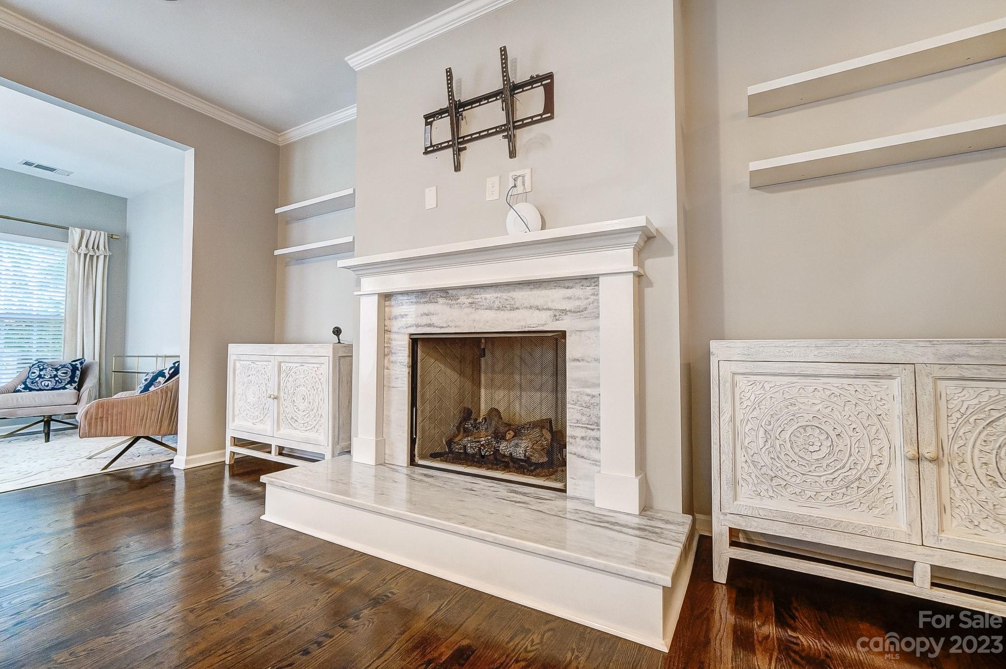 231 Lincoln Street Charlotte, NC 28203 - Photo 19 of 48 a living room with furniture and a fireplace