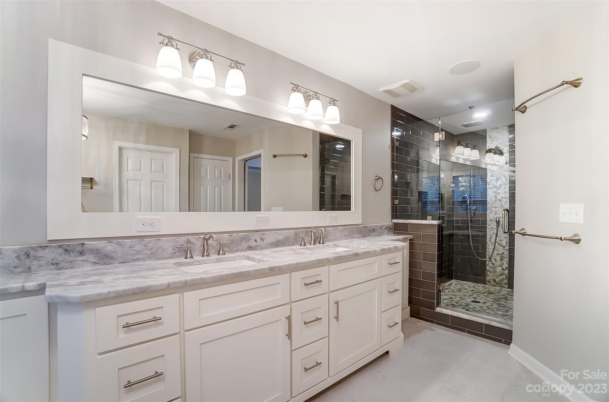231 Lincoln Street Charlotte, NC 28203 - Photo 29 of 48 a bathroom with a granite countertop sink mirror and double