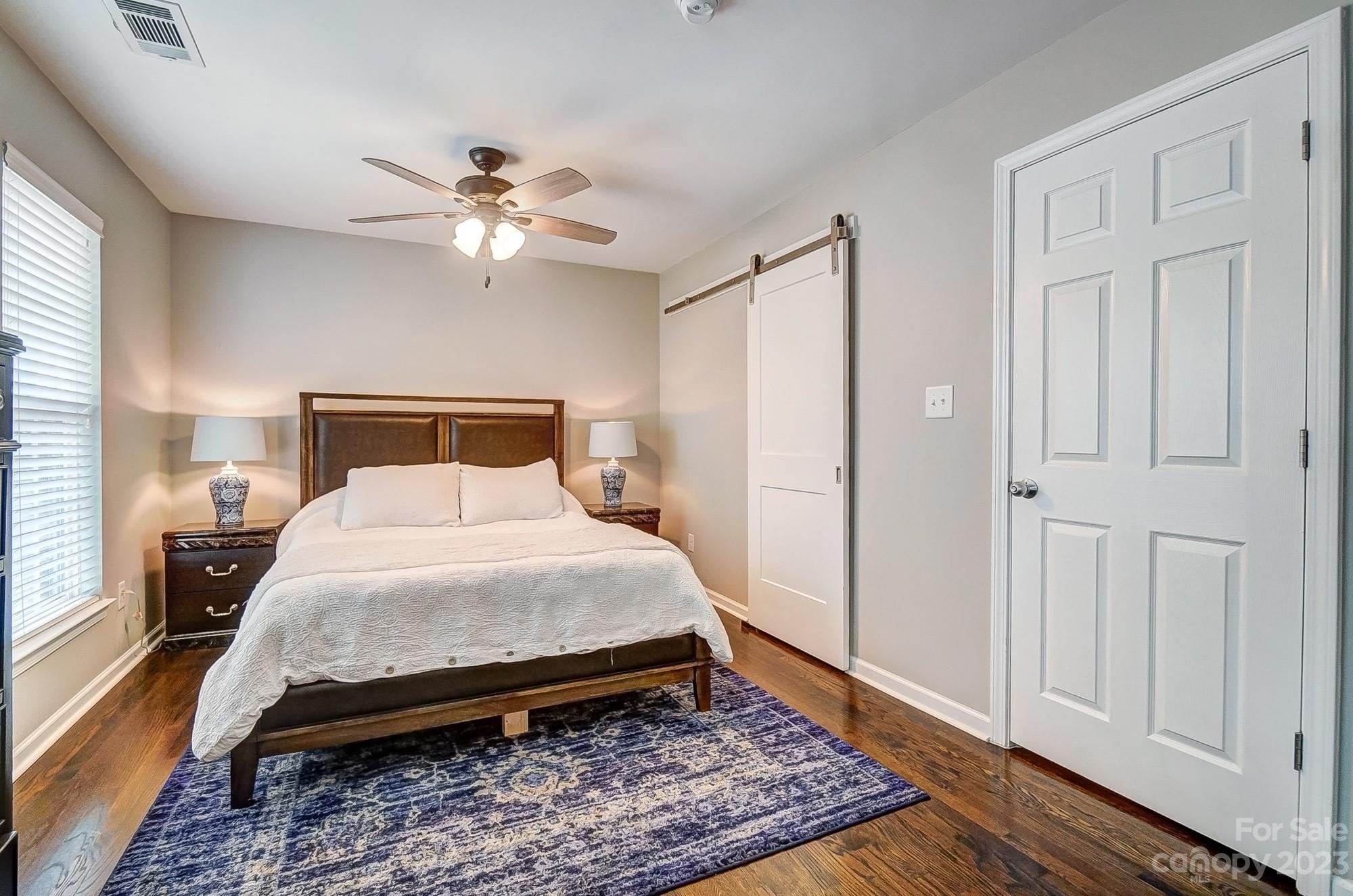 231 Lincoln Street Charlotte, NC 28203 - Photo 33 of 48 a bedroom with a bed and a window