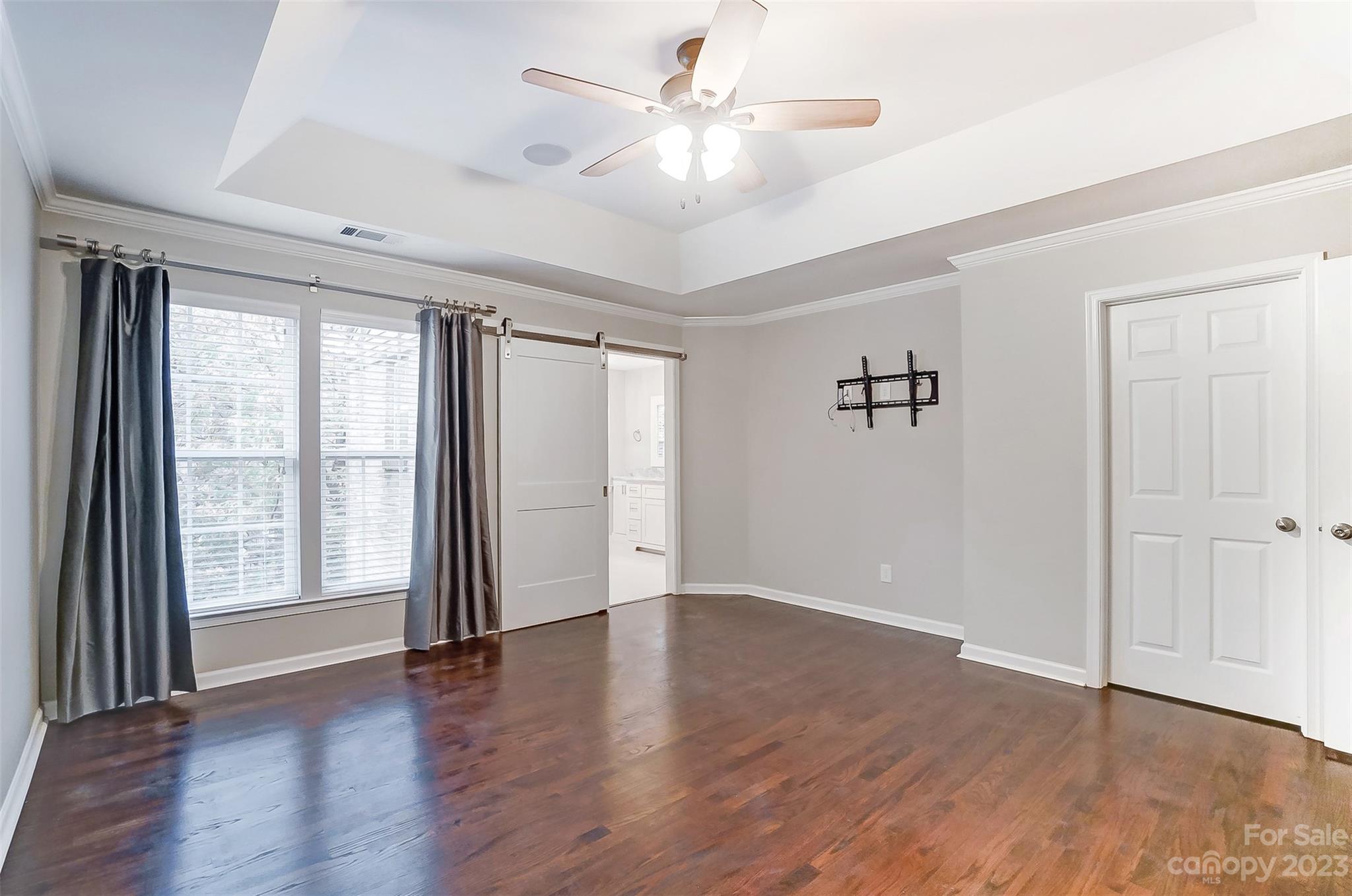 231 Lincoln Street Charlotte, NC 28203 - Photo 40 of 48 wooden floor in an empty room with a window