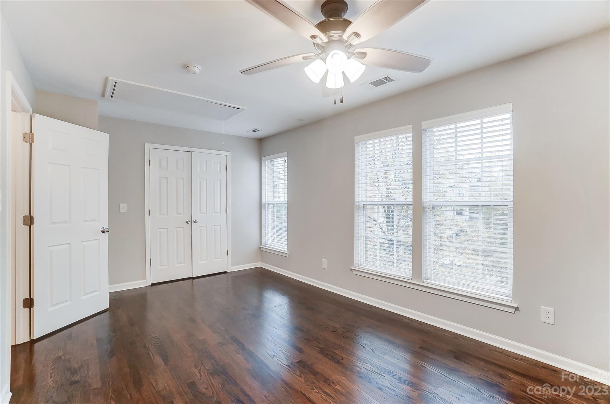 231 Lincoln Street Charlotte, NC 28203 - Photo 41 of 48 a view of an empty room with wooden floor and a window