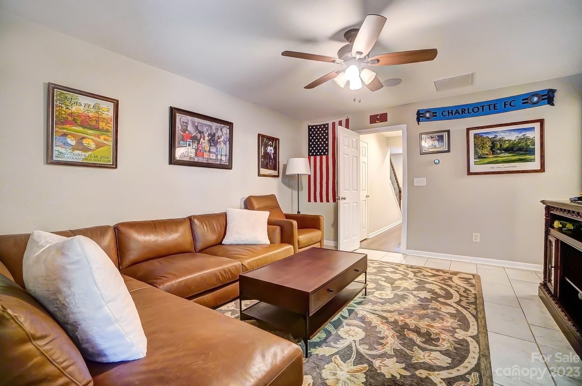 231 Lincoln Street Charlotte, NC 28203 - Photo 7 of 48 a living room with furniture and a rug