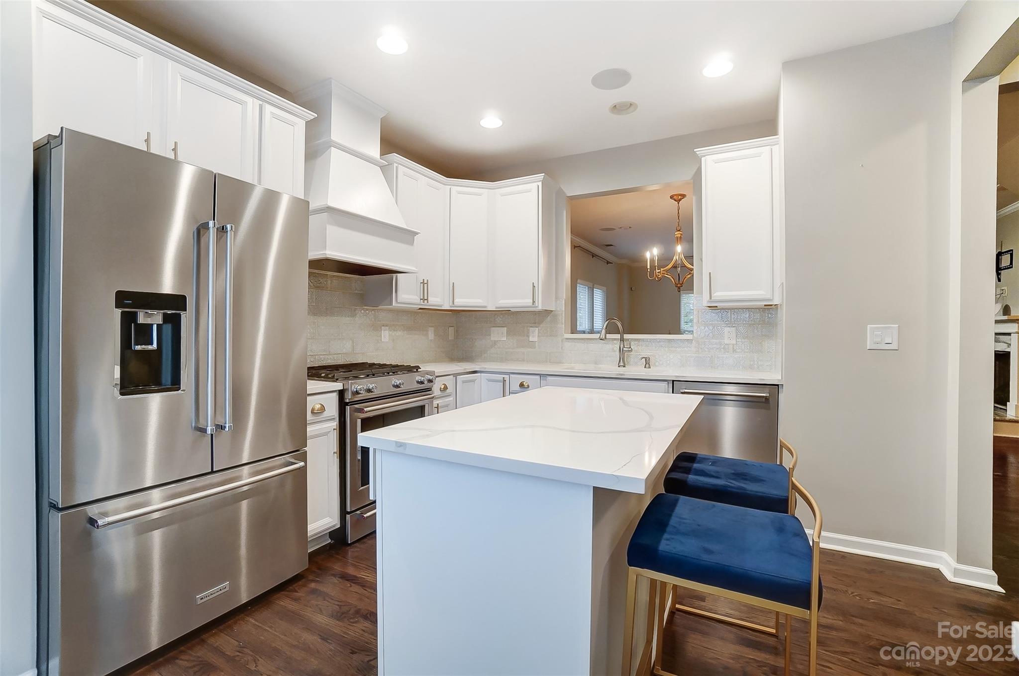 231 Lincoln Street Charlotte, NC 28203 - Photo 10 of 48 a kitchen with stainless steel appliances a refrigerator sink and microwave