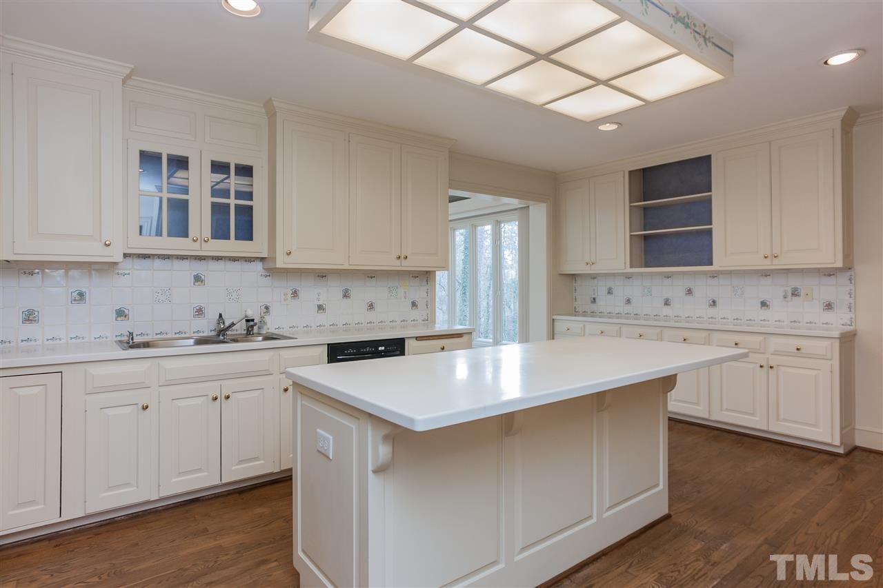 3400 Landor Road Raleigh, NC 27609 - Photo 11 of 25 a kitchen that has a sink and a stove in it