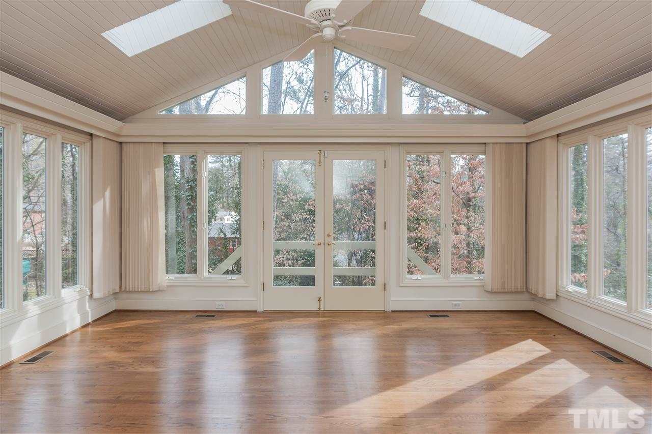 3400 Landor Road Raleigh, NC 27609 - Photo 13 of 25 a view of an empty room with wooden floor and a window