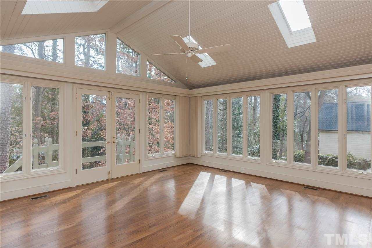 3400 Landor Road Raleigh, NC 27609 - Photo 14 of 25 a view of an empty room with wooden floor and a window